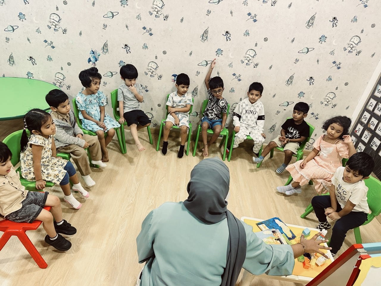 Children gathered on the floor for a story with their teacher